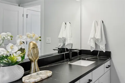 a view of a patio with table and chairs and potted plants