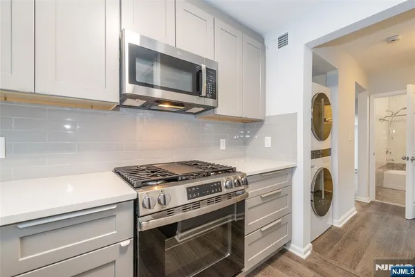 a kitchen with a stove and a microwave