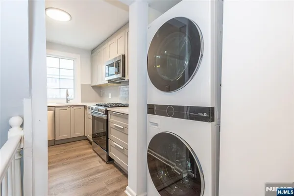 a view of a kitchen with washer and dryer