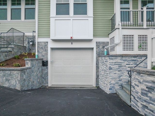 a view of a house with a door and wooden walls