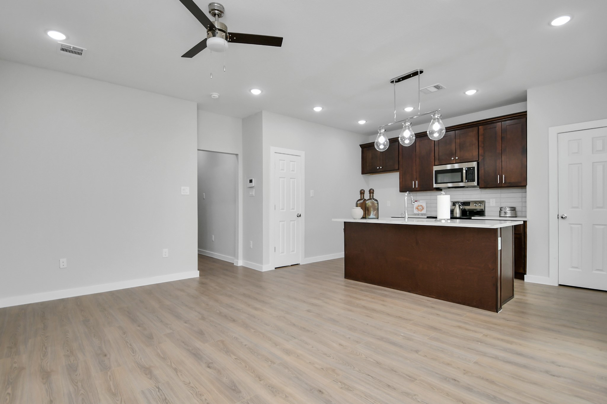 9808 Nedwald Street Houston, TX 77029 - Photo 19 of 39 a view of kitchen with refrigerator and microwave