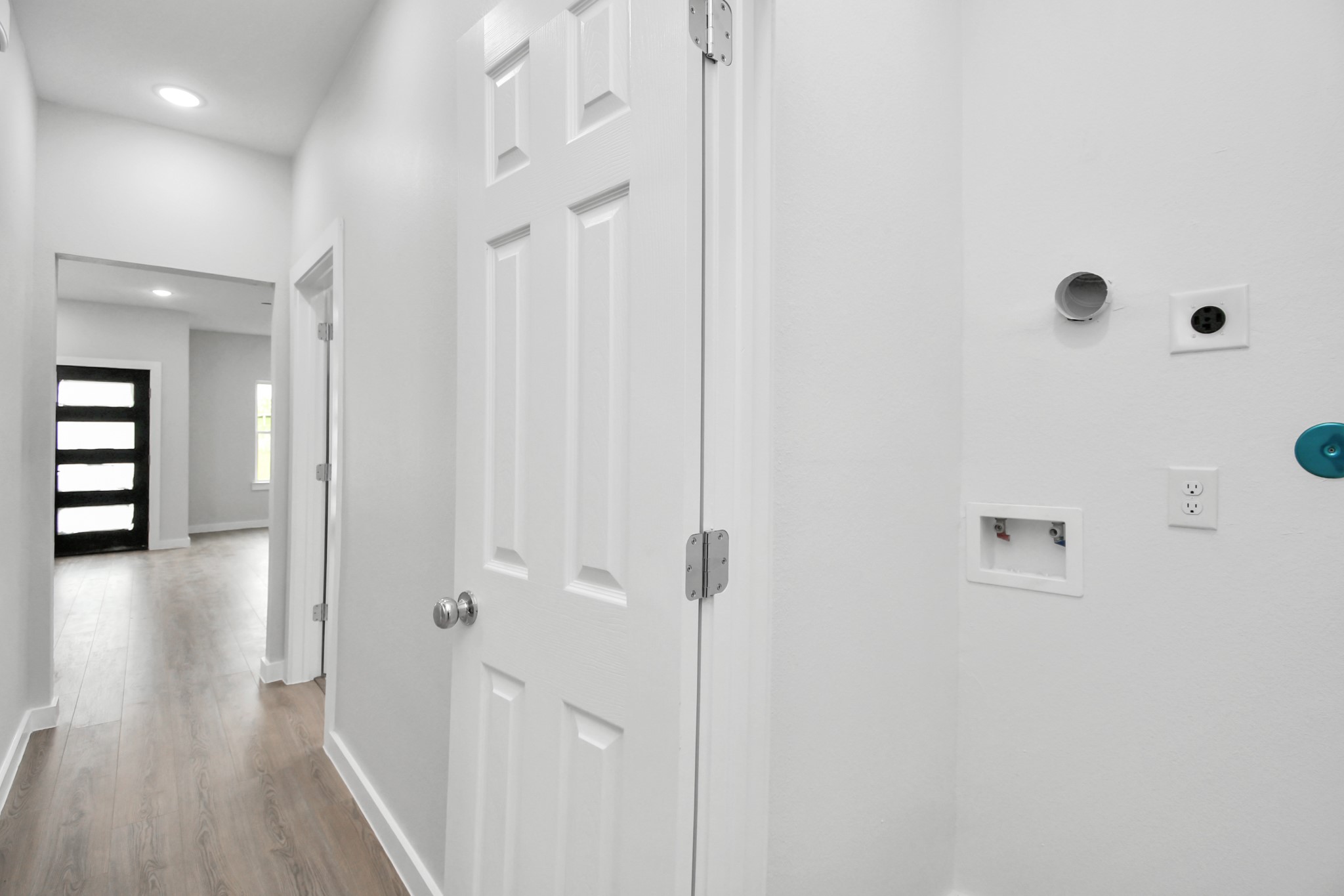 9808 Nedwald Street Houston, TX 77029 - Photo 25 of 39 a view of a hallway with wooden floor