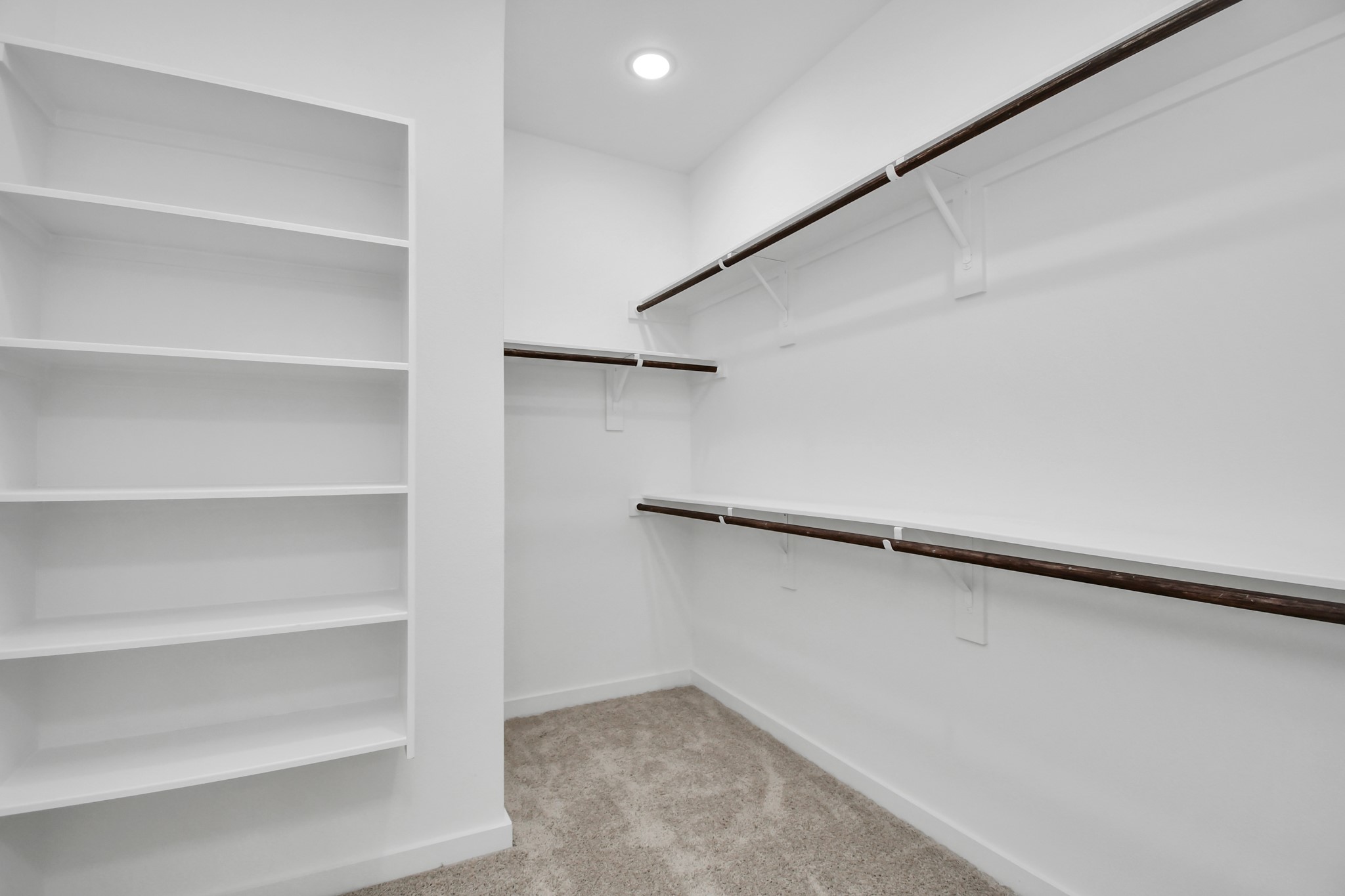 9808 Nedwald Street Houston, TX 77029 - Photo 30 of 39 a view of an empty walk in closet