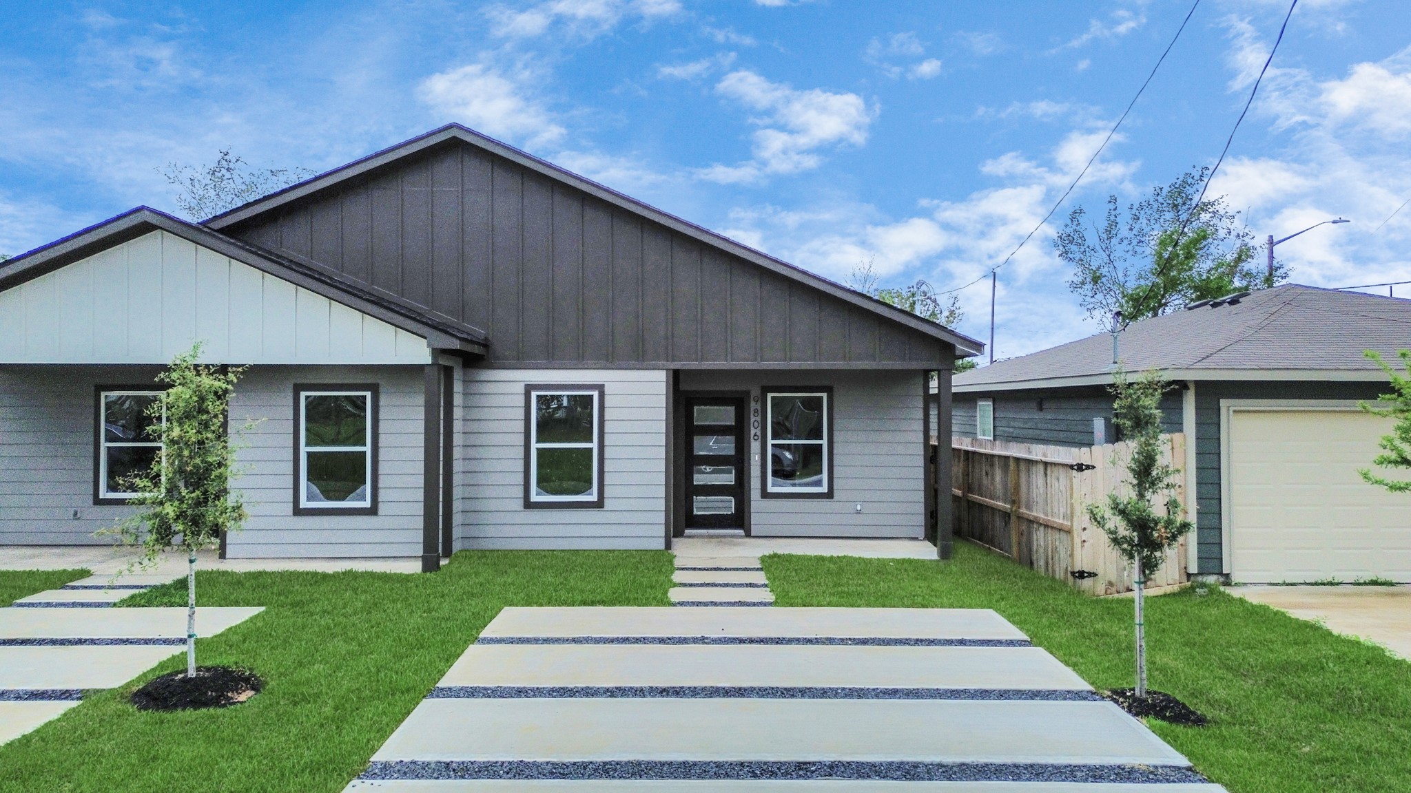9808 Nedwald Street Houston, TX 77029 - Photo 3 of 39 a front view of a house with a yard