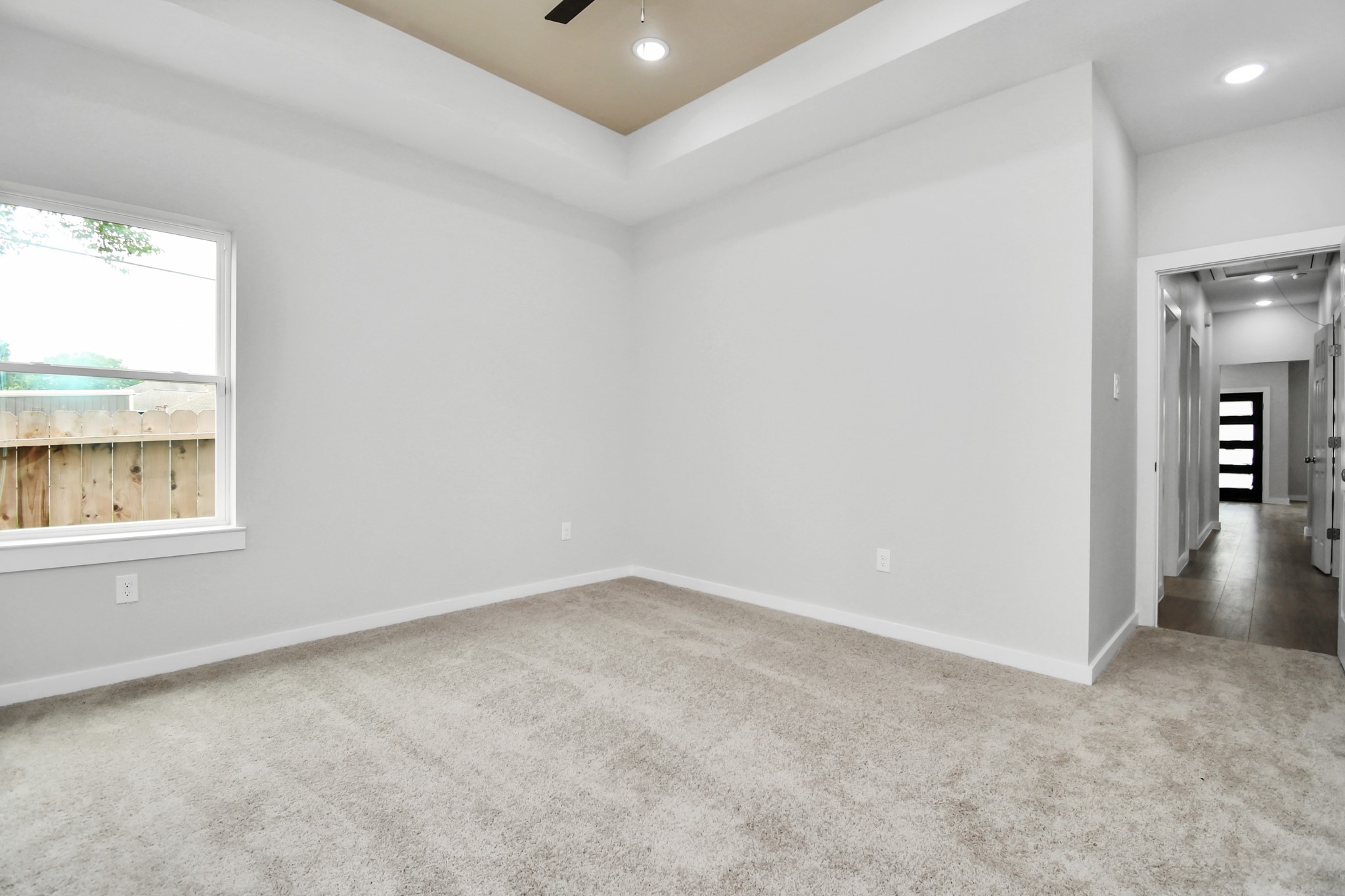 9808 Nedwald Street Houston, TX 77029 - Photo 35 of 39 an empty room with a window and wooden floor