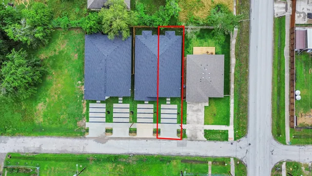 a view of a house with a yard and plants