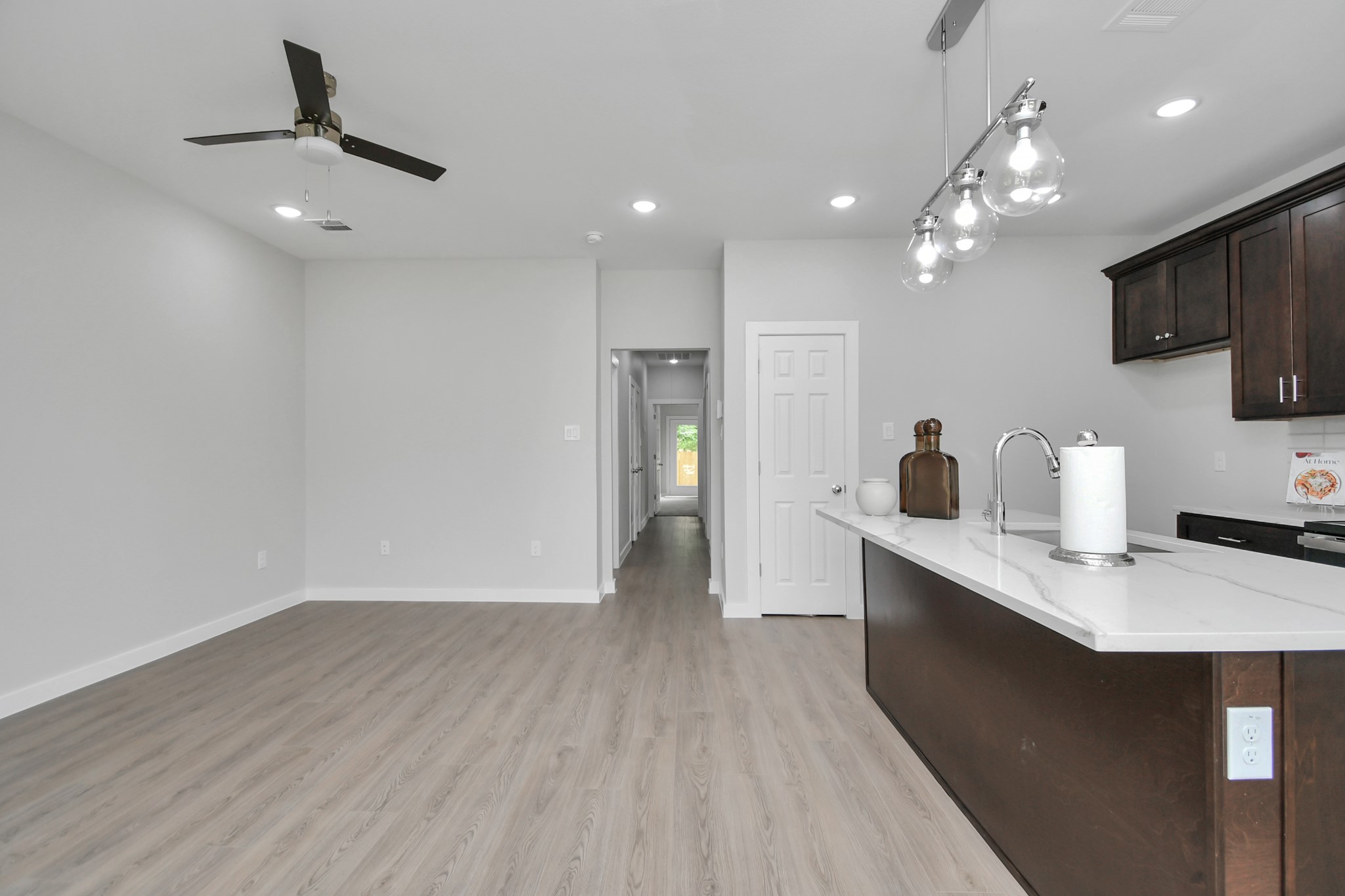 9808 Nedwald Street Houston, TX 77029 - Photo 9 of 39 a kitchen with kitchen island a sink stainless steel appliances and cabinets