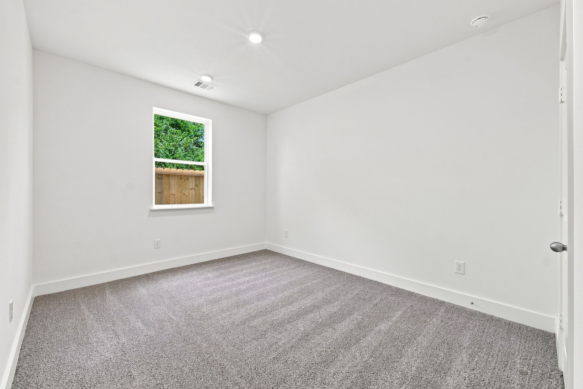 6057 Cebra Street Houston, TX 77091 - Photo 40 of 42 Bedroom 3 offers natural light, neutral finishes, and a comfortable, versatile layout. Photos are from a different property with a similar floor plan. Finishes, features, and orientation may vary.
