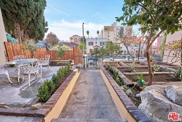 a view of a backyard with sitting area
