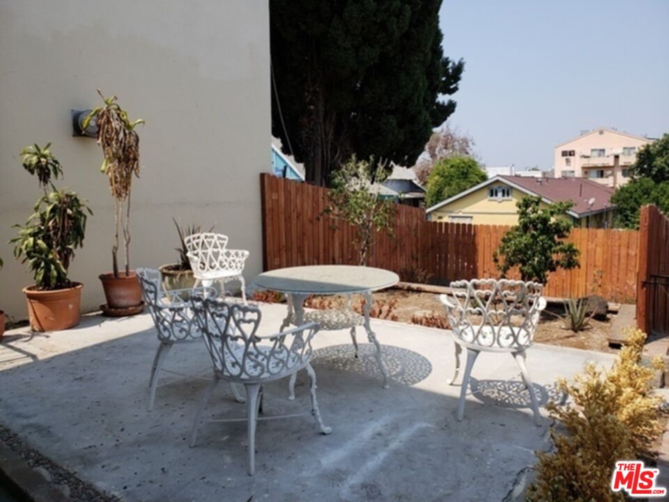 826 South Park View Street, Unit 1 Los Angeles, CA 90057 - Photo 5 of 14 a view of a chairs and table in patio