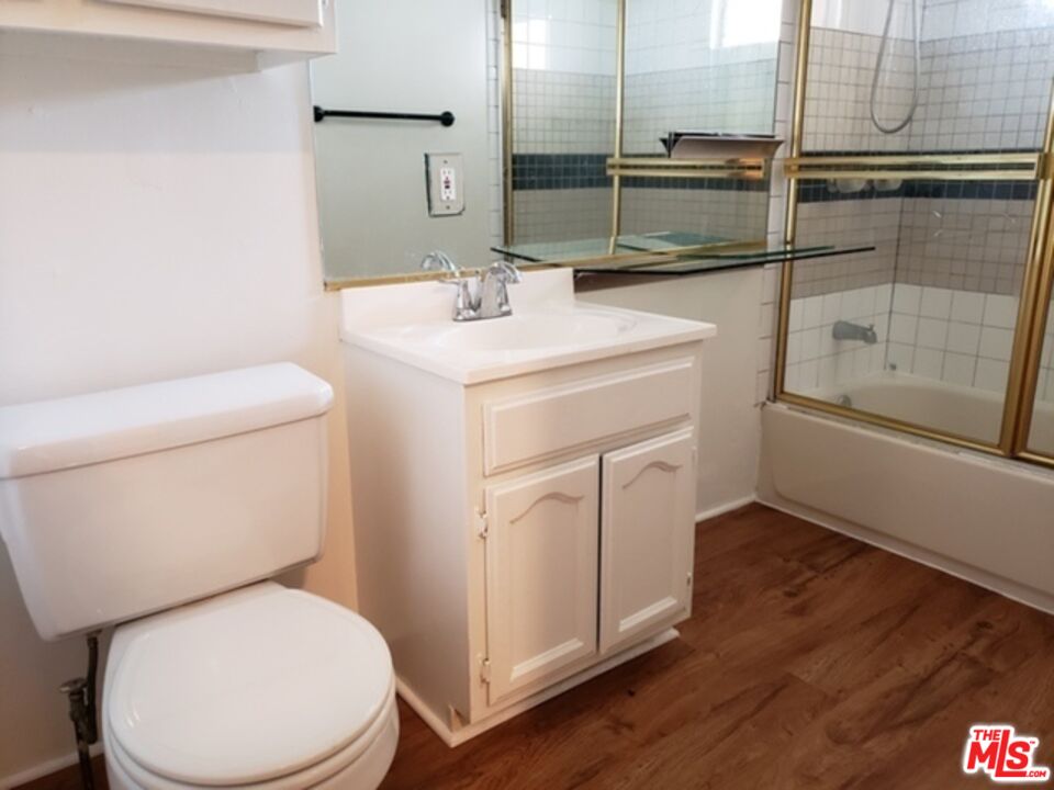 826 South Park View Street, Unit 1 Los Angeles, CA 90057 - Photo 8 of 14 a bathroom with a toilet sink and a mirror