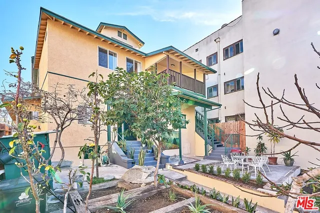 a view of a building with a yard