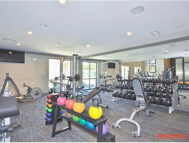 a living room filled with furniture and wooden floor