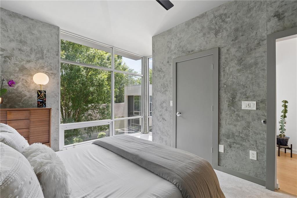 752 Moreland Avenue Southeast, Unit 4 Atlanta, GA 30316 - Photo 35 of 58 a bedroom with a large bed and a large window