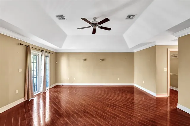 a view of a bathroom with a sink and wooden floor