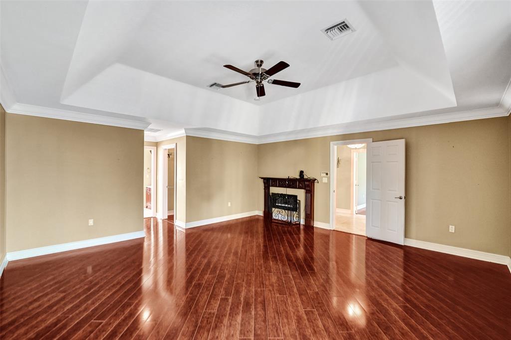101 Northeast 21st Street Wilton Manors, FL 33305 - Photo 29 of 70 a view of a livingroom with wooden floor and a ceiling fan