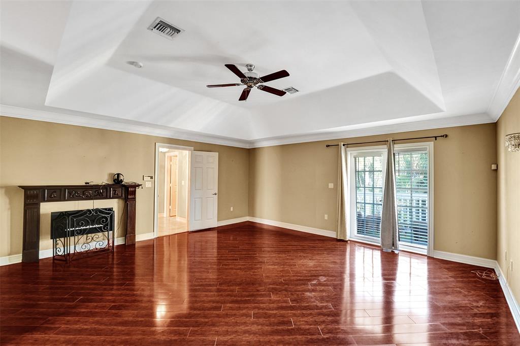 101 Northeast 21st Street Wilton Manors, FL 33305 - Photo 30 of 70 a view of empty room with wooden floor and fireplace