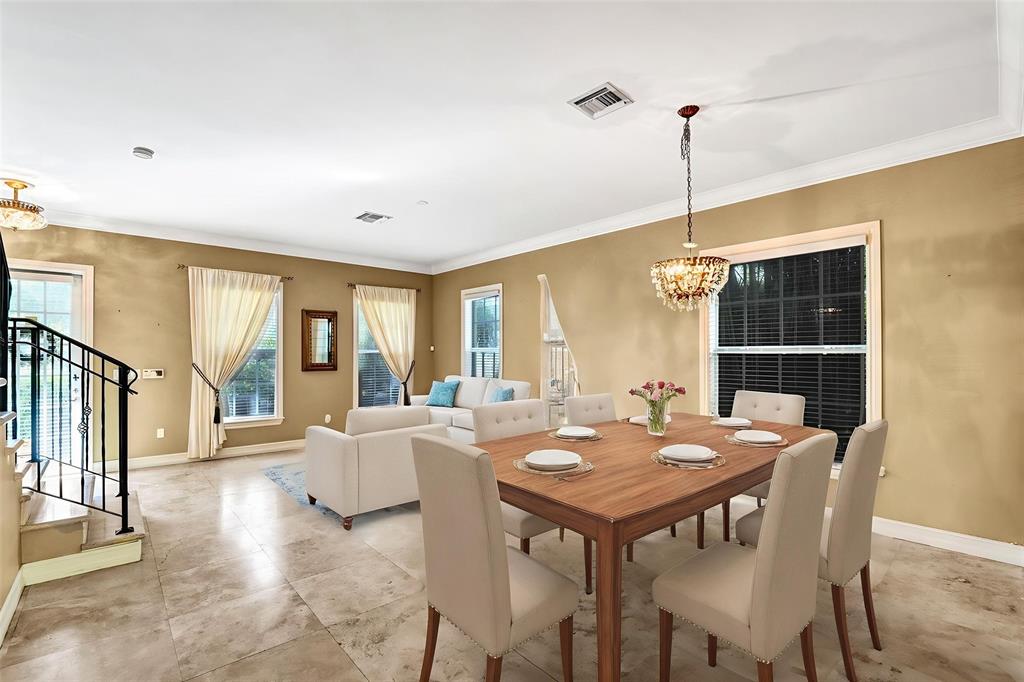 101 Northeast 21st Street Wilton Manors, FL 33305 - Photo 3 of 70 a view of a dining room with furniture window and wooden floor