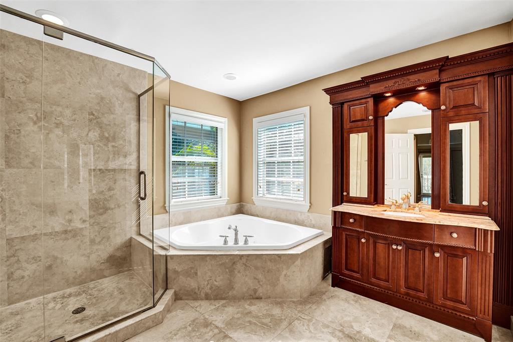 101 Northeast 21st Street Wilton Manors, FL 33305 - Photo 34 of 70 a bathroom with a bathtub and a sink