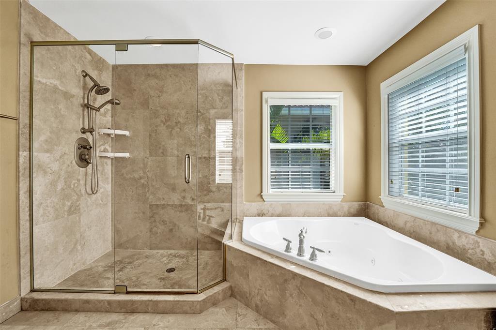 101 Northeast 21st Street Wilton Manors, FL 33305 - Photo 35 of 70 a bath tub sitting next to a shower