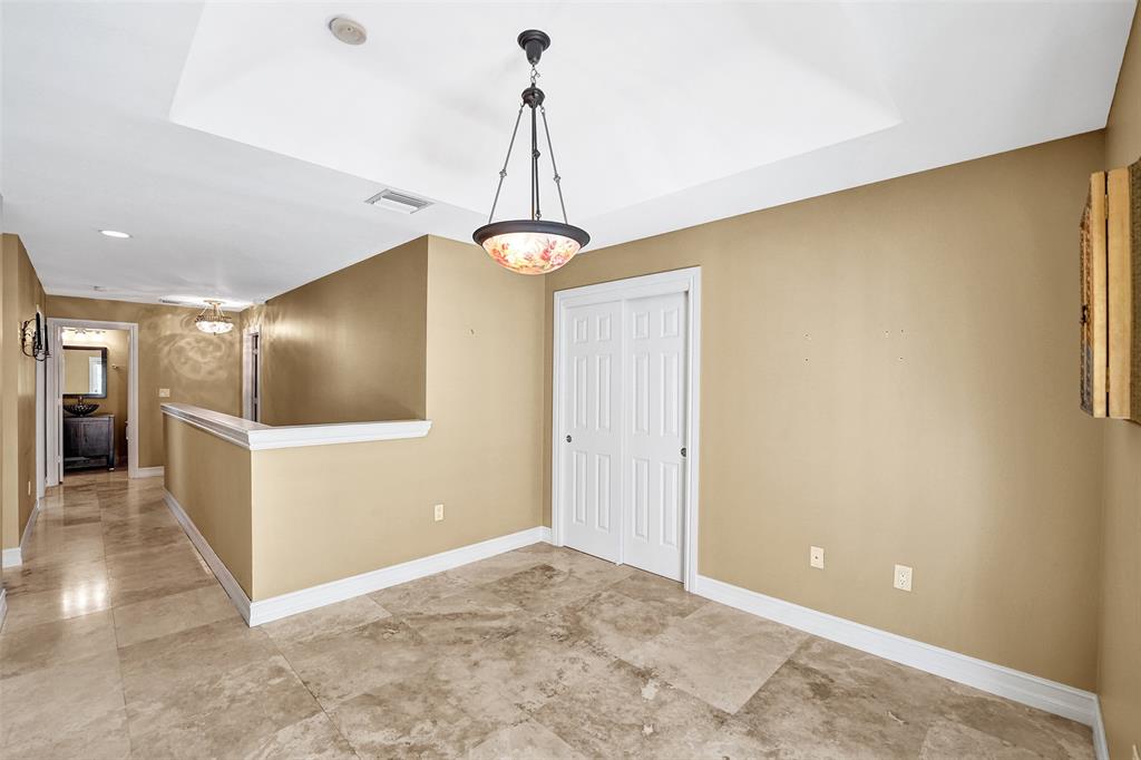 101 Northeast 21st Street Wilton Manors, FL 33305 - Photo 43 of 70 a view of a livingroom with a furniture wooden floor and a chandelier