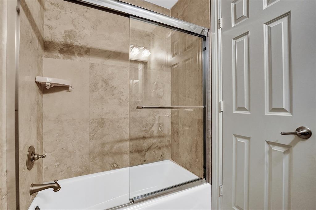 101 Northeast 21st Street Wilton Manors, FL 33305 - Photo 45 of 70 a bathroom with a shower and a glass door