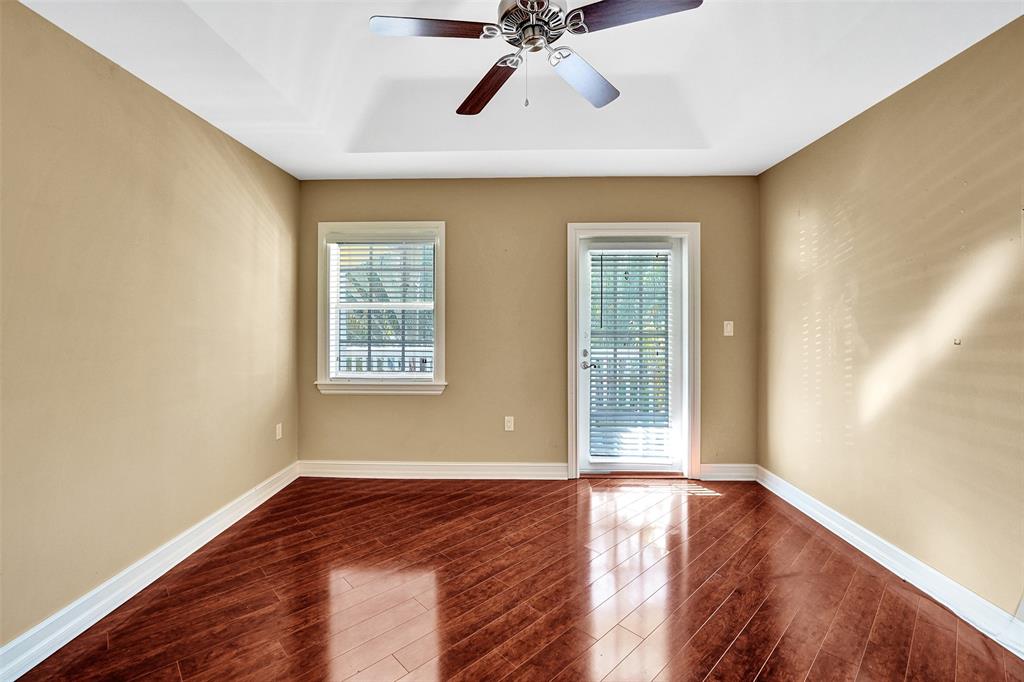 101 Northeast 21st Street Wilton Manors, FL 33305 - Photo 47 of 70 a view of a livingroom with wooden floor and a ceiling fan