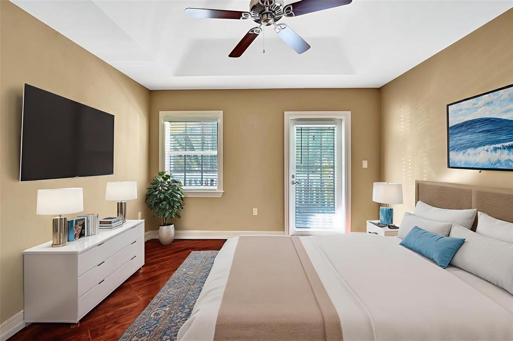 101 Northeast 21st Street Wilton Manors, FL 33305 - Photo 48 of 70 a spacious bedroom with a large bed and a flat screen tv