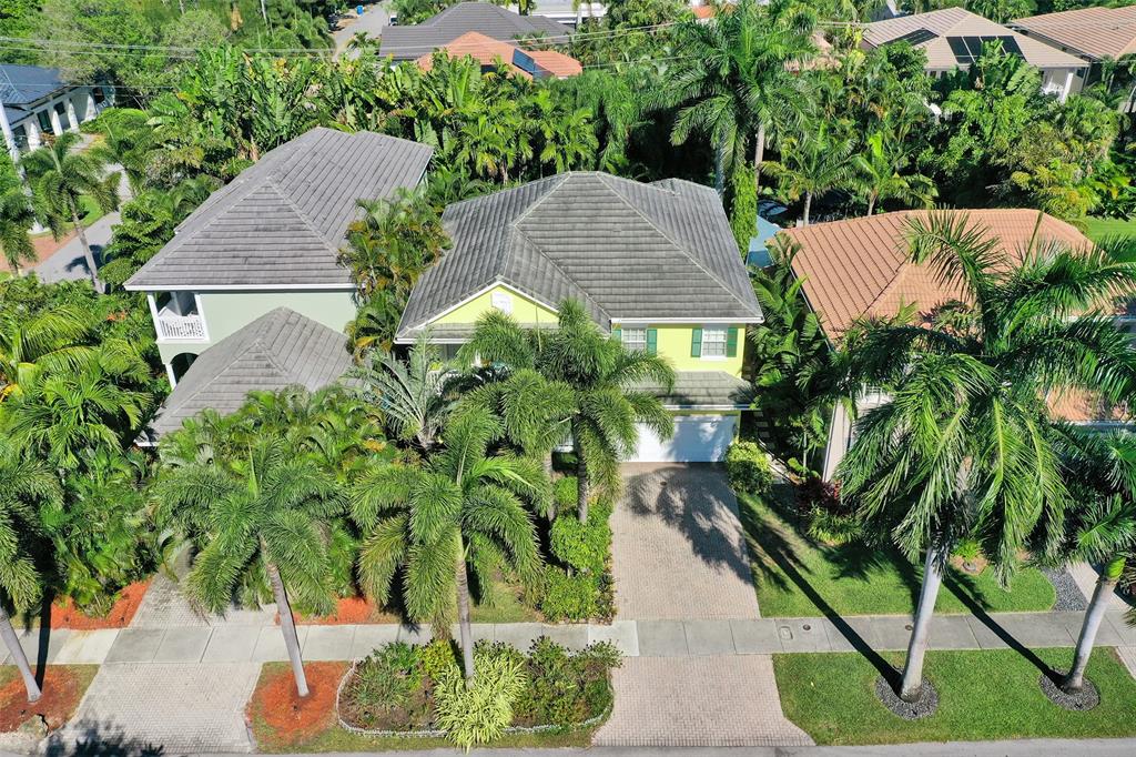 101 Northeast 21st Street Wilton Manors, FL 33305 - Photo 64 of 70 an aerial view of a house with yard and swimming pool