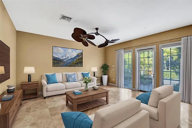 a large kitchen with stainless steel appliances kitchen island granite countertop a refrigerator and a sink