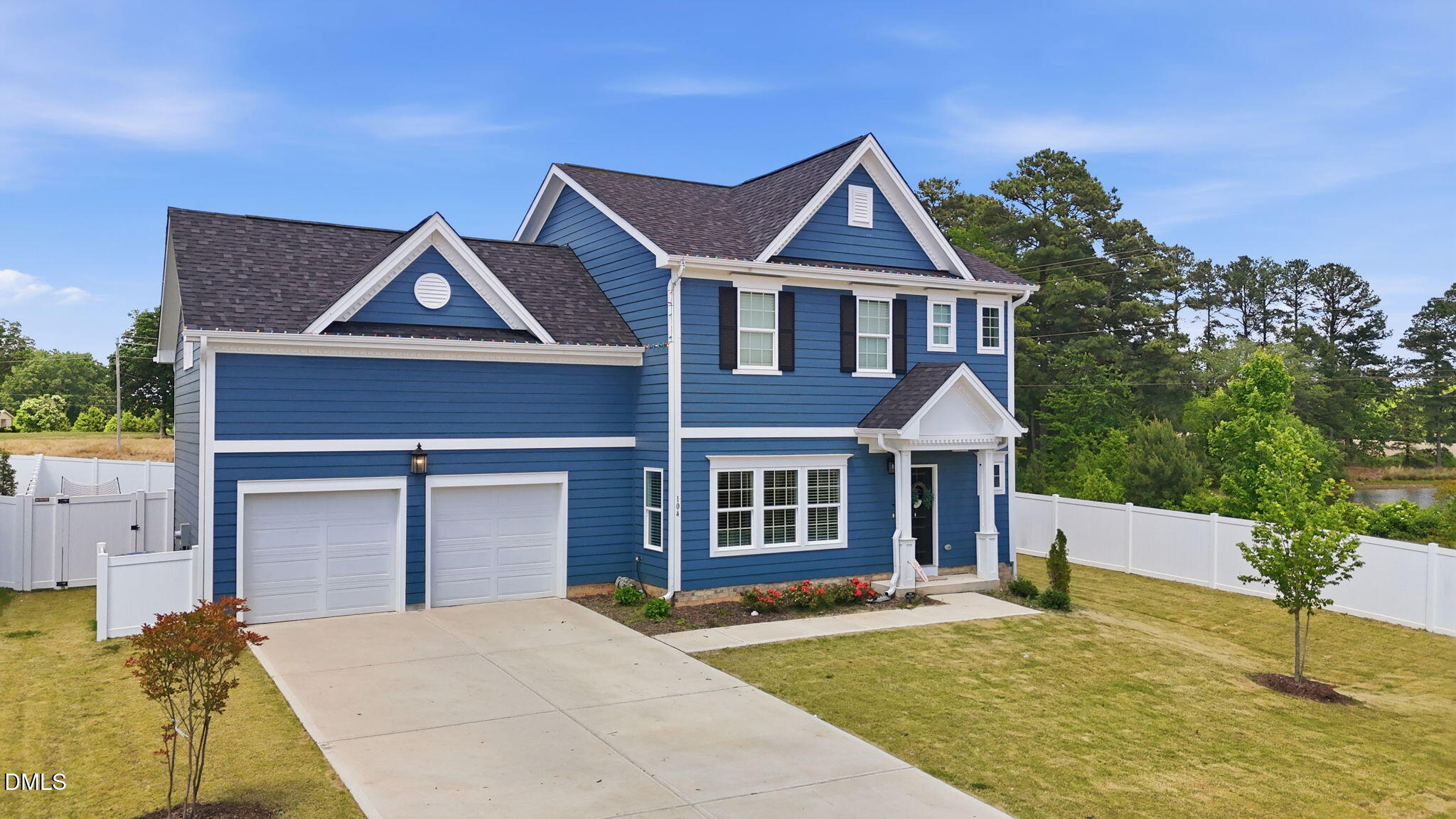 104 Kavanaugh Road Wake Forest, NC 27587 - Photo 3 of 36 a front view of a house with garden