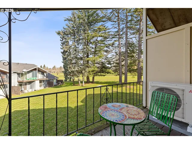 a view of a balcony with chairs