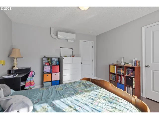 a bed room with a bed and a book shelf