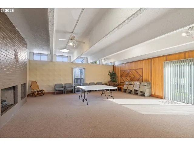 a room with furniture and a large window