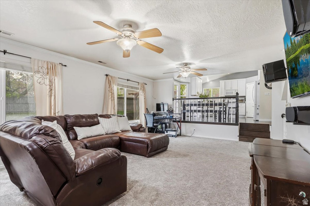 7975 Showcase Lane Sandy, UT 84094 - Photo 10 of 29 Large family room open to dining and kitchen. Offers space for multiple uses.