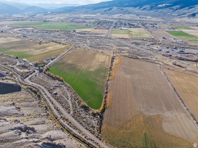 Undisclosed Address Joseph, UT 84739 - Photo 8 of 14 Aerial view of property's location featuring rural landscape, a mountain backdrop, and rows of crops