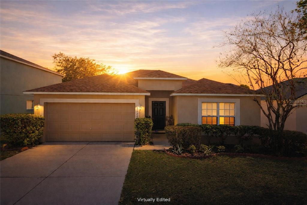 2120 Nicollett Way Leesburg, FL 34748 - Photo 20 of 22 a front view of a house with a yard and garage