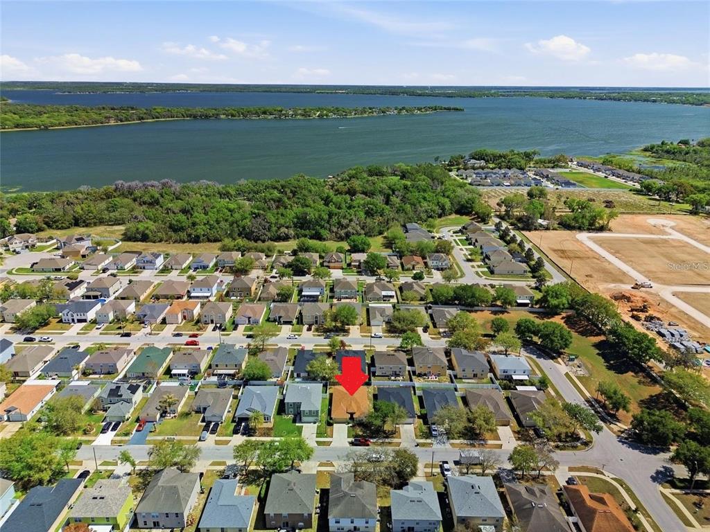 2120 Nicollett Way Leesburg, FL 34748 - Photo 22 of 22 an aerial view of a city with lots of residential buildings and ocean view in back