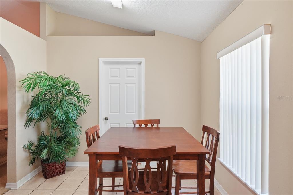 2120 Nicollett Way Leesburg, FL 34748 - Photo 5 of 22 a view of a dining room with furniture and window