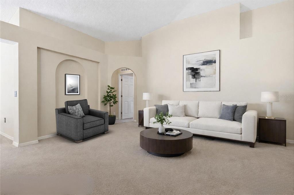 2120 Nicollett Way Leesburg, FL 34748 - Photo 7 of 22 a living room with furniture and a painting on the wall