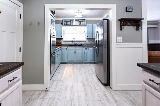 a living room with furniture and a clock