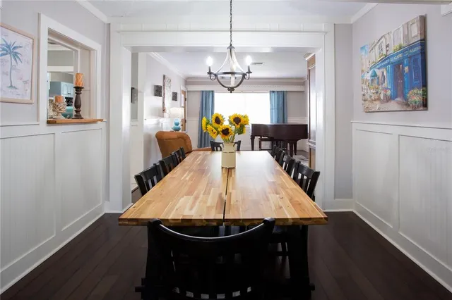 a bed room with a bed window and a flat screen tv