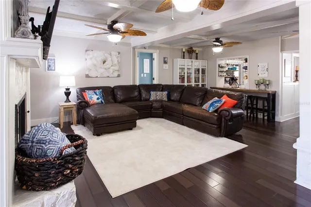 a bathroom with a granite countertop toilet sink and mirror