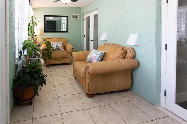 a view of a chairs and table in the patio