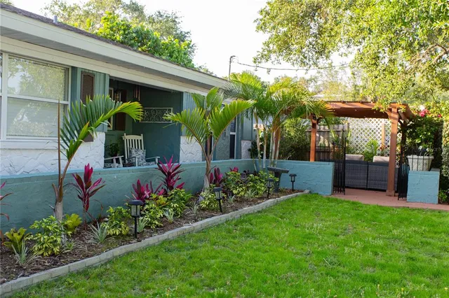 a kitchen with stainless steel appliances granite countertop a sink and cabinets