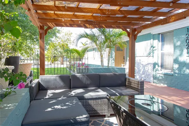 a view of a dining room with furniture wooden floor and chandelier