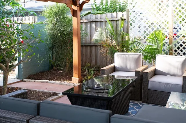 a living room with furniture and a fireplace or television