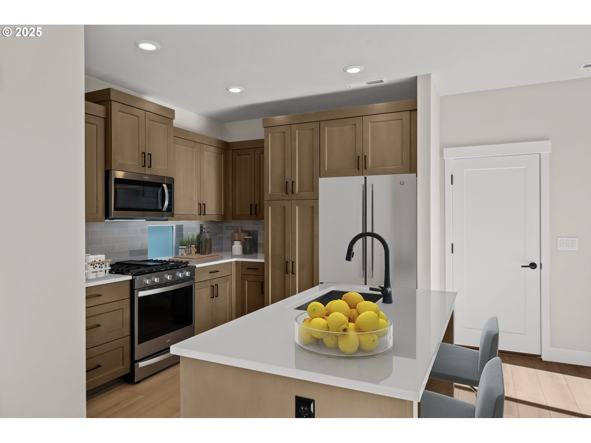 2463 North Villa Road Newberg, OR 97132 - Photo 4 of 10 a kitchen with a stove a refrigerator and a microwave