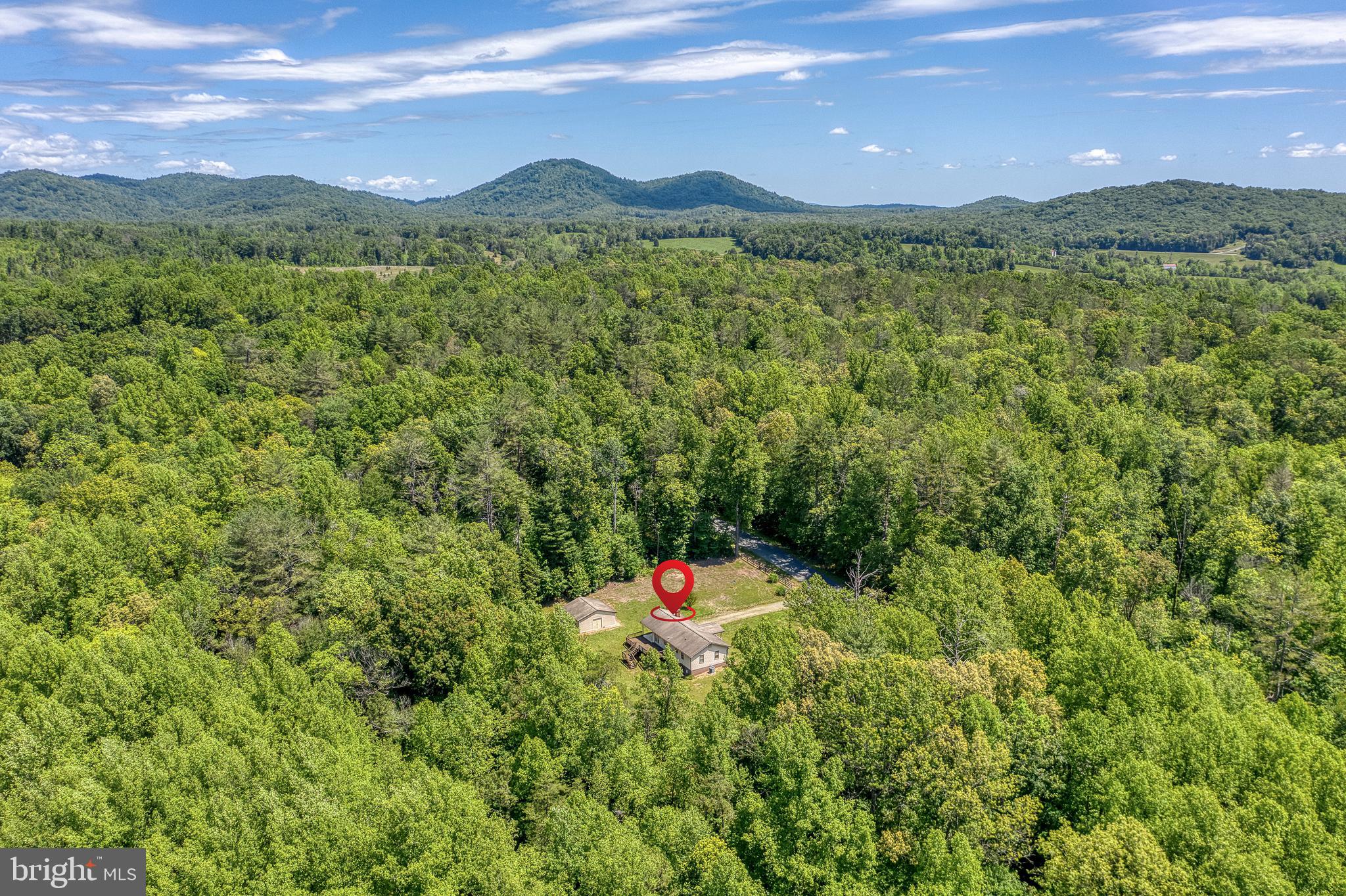 803 Weaver Hollow Road Banco, VA 22711 - Photo 46 of 67 a backyard of a house with a yard and mountain view