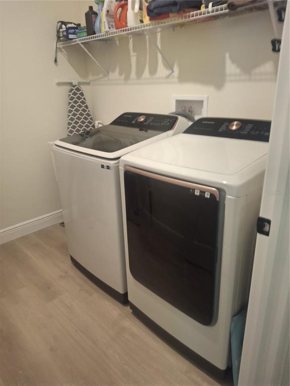 12618 Vander Way New Port Richey, FL 34654 - Photo 13 of 22 a utility room with dryer and washer